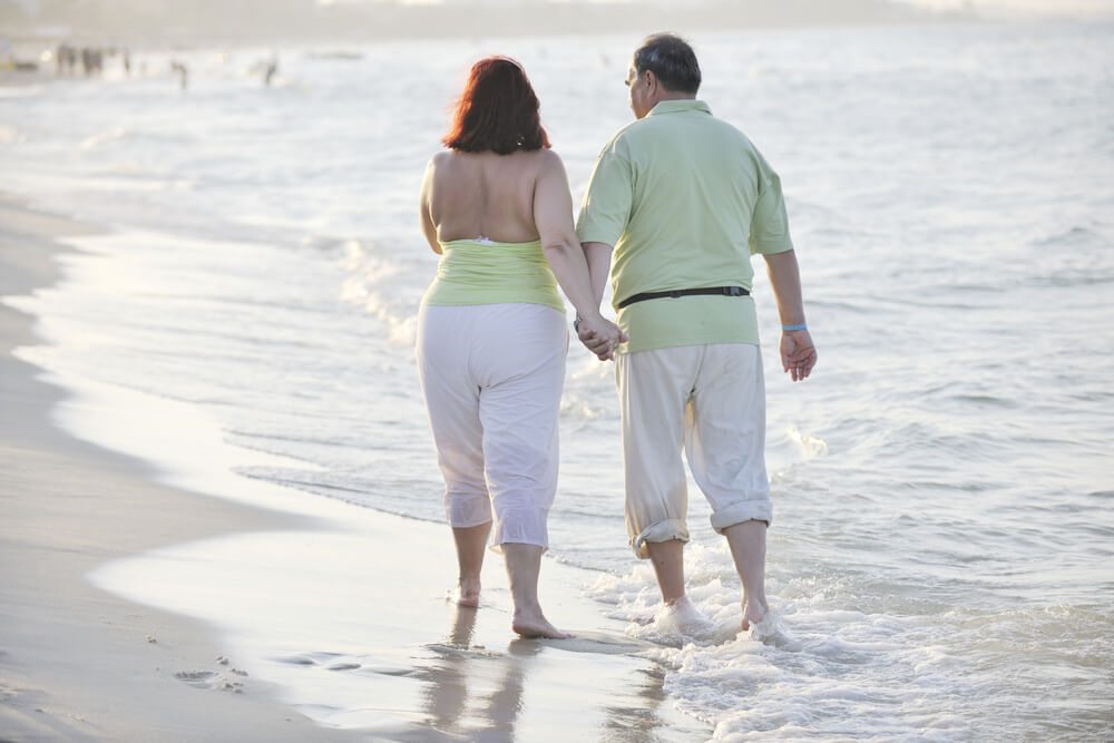 Couple on beach at sunset